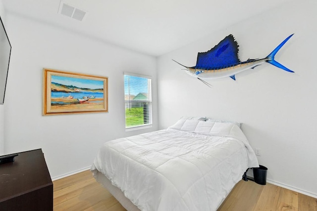 7506 Grenadine Bloom Bnd, Del Valle, TX 78617 - bedroom featuring wood finished floors and baseboards