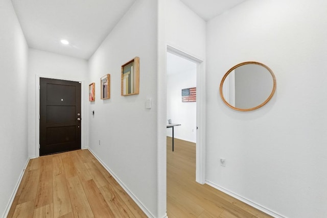 7506 Grenadine Bloom Bnd, Del Valle, TX 78617 - corridor featuring light wood-type flooring, baseboards, and recessed lighting