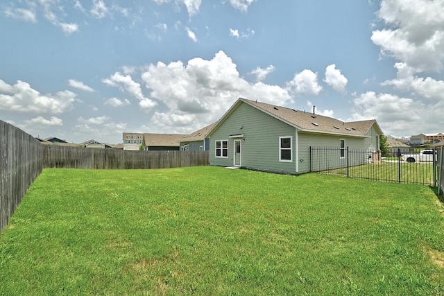 7506 Grenadine Bloom Bnd, Del Valle, TX 78617 - rear view of property with a fenced backyard