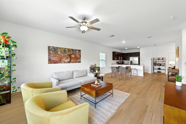 7506 Grenadine Bloom Bnd, Del Valle, TX 78617 - living room with ceiling fan, light wood-type flooring, and recessed lighting