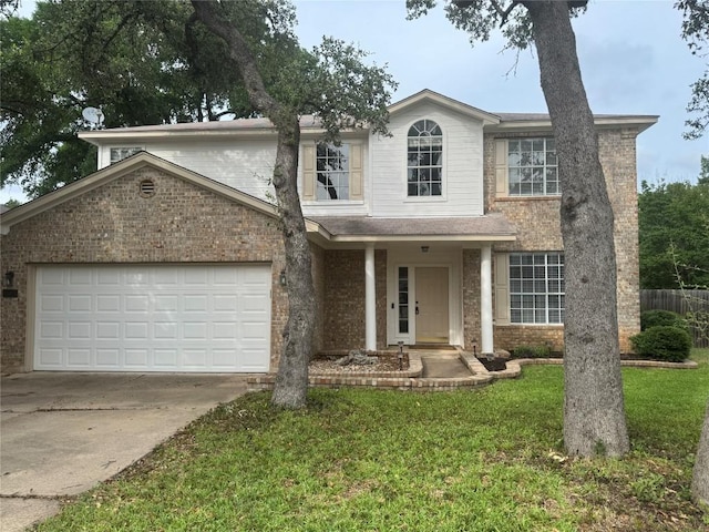 2606 Melba Pass, Cedar Park, TX 78613 - traditional-style house with brick siding, an attached garage, and driveway
