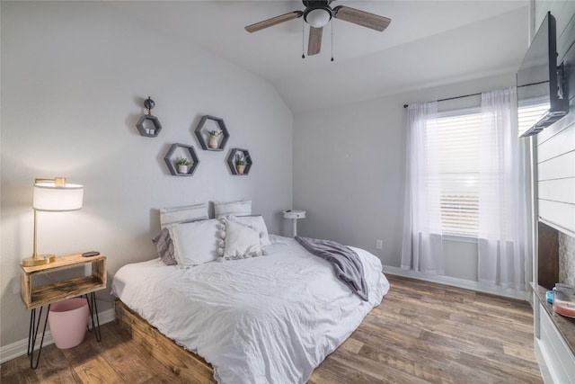 309 Callahan Ln, Leander, TX 78641 - bedroom with lofted ceiling, wood finished floors, baseboards, and ceiling fan
