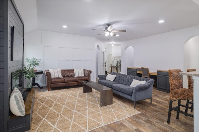 309 Callahan Ln, Leander, TX 78641 - living room with arched walkways, a decorative wall, ceiling fan, wood finished floors, and recessed lighting