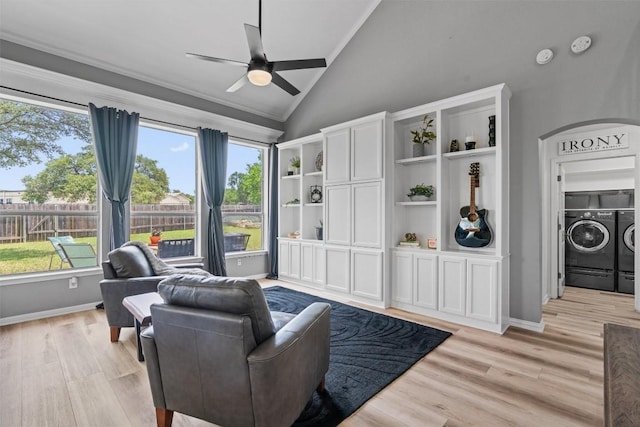120 Spring Ct, Georgetown, TX 78633 - living room featuring separate washer and dryer, lofted ceiling, ceiling fan, healthy amount of natural light, and light wood-type flooring