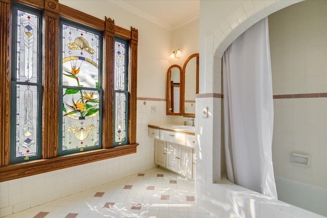 full bath with vanity, tile walls, shower / bathtub combination with curtain, ornamental molding, and tile patterned flooring