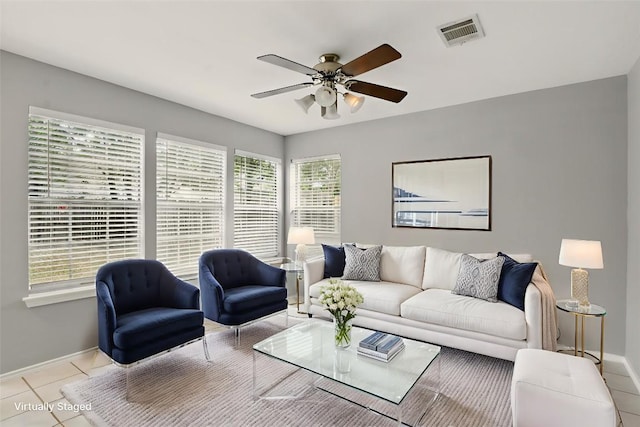 902 Valley Glen Cv, Pflugerville, TX 78660 - living room with baseboards, ceiling fan, and tile patterned floors