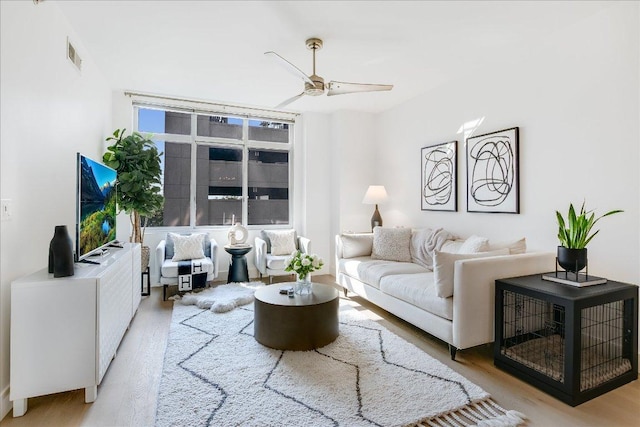 54 Rainey St Unit 617, Austin, TX 78701 - living room featuring light wood-style flooring and a ceiling fan