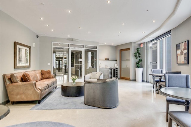 54 Rainey St Unit 617, Austin, TX 78701 - living room with wine cooler, concrete flooring, and recessed lighting