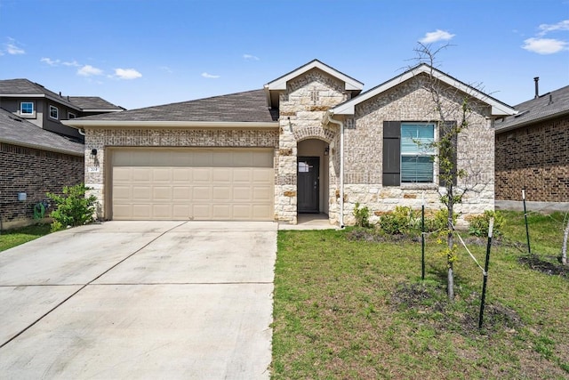 204 Connor Ln, Georgetown, TX 78626 - view of front facade with stone siding, concrete driveway, a garage, and a front lawn