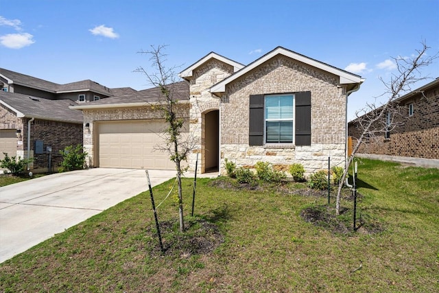 204 Connor Ln, Georgetown, TX 78626 - view of front facade featuring stone siding, a garage, driveway, a front yard, and brick siding