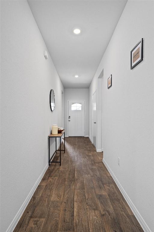 204 Connor Ln, Georgetown, TX 78626 - entryway with dark wood finished floors and baseboards