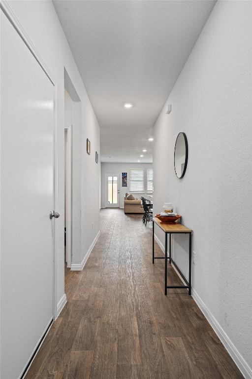 204 Connor Ln, Georgetown, TX 78626 - corridor with wood finished floors, baseboards, and recessed lighting