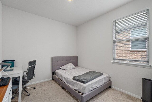 204 Connor Ln, Georgetown, TX 78626 - carpeted bedroom with baseboards and a desk
