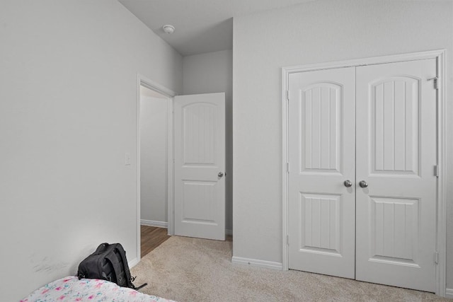 204 Connor Ln, Georgetown, TX 78626 - bedroom with carpet flooring, a closet, and baseboards