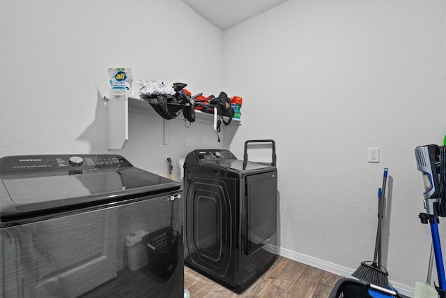 204 Connor Ln, Georgetown, TX 78626 - laundry room featuring washer and dryer, wood finished floors, and baseboards