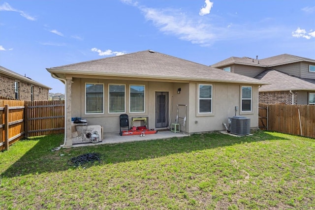 204 Connor Ln, Georgetown, TX 78626 - back of property with central air condition unit, stucco siding, and a patio area