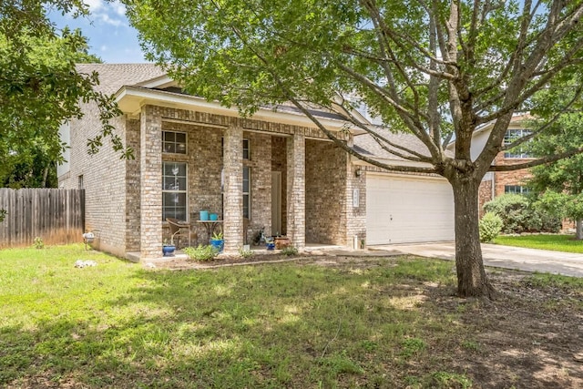 101 Cannery Cv, Leander, TX 78641 - view of front of property featuring concrete driveway, brick siding, and an attached garage