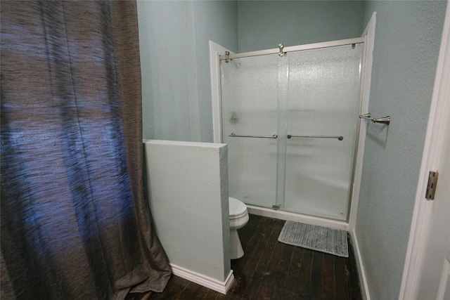 793 N Houston Ave, New Braunfels, TX 78130 - full bath with a stall shower, wood finished floors, toilet, and baseboards