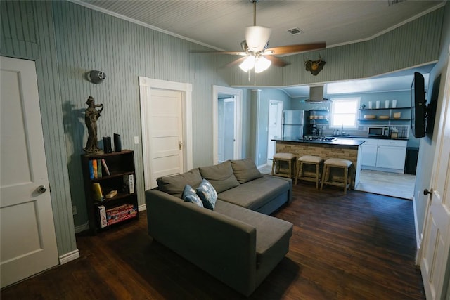 793 N Houston Ave, New Braunfels, TX 78130 - living room with dark wood-style flooring, ceiling fan, and ornamental molding