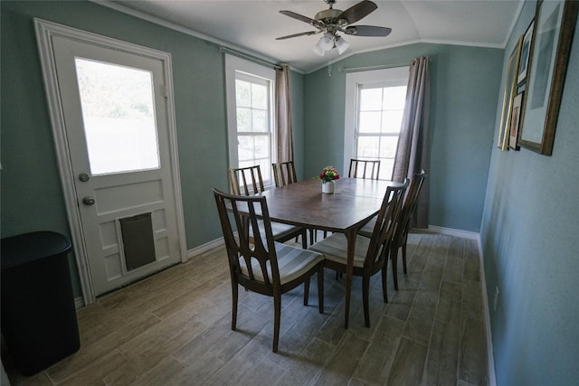 793 N Houston Ave, New Braunfels, TX 78130 - dining room with lofted ceiling, dark wood-type flooring, baseboards, crown molding, and ceiling fan