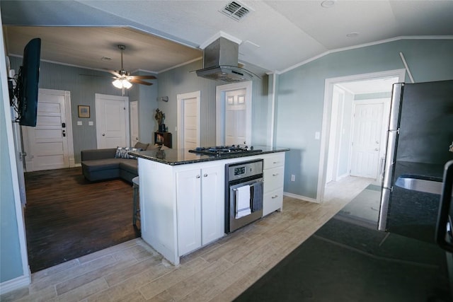 793 N Houston Ave, New Braunfels, TX 78130 - kitchen featuring stainless steel oven, island range hood, light wood-style floors, ceiling fan, and white cabinetry