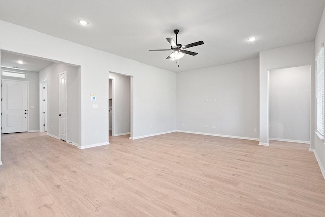 300 Treadwell Ln, Kyle, TX 78640 - unfurnished living room with ceiling fan, light wood-style floors, recessed lighting, and baseboards