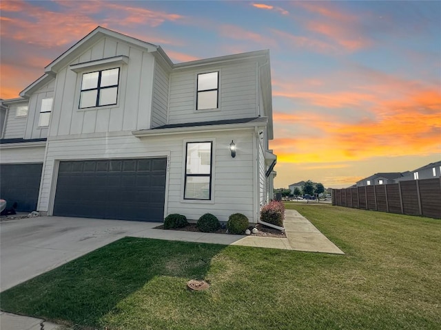 179 Threshing Rd Unit C, Buda, TX 78610 - view of front of property featuring an attached garage, board and batten siding, and driveway