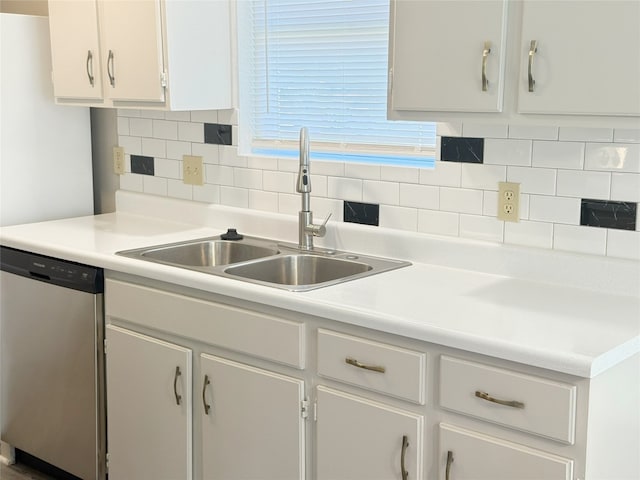 905 Rolling Green Dr, Round Rock, TX 78664 - kitchen featuring stainless steel dishwasher, a sink, white cabinets, backsplash, and light countertops
