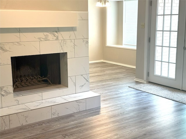 905 Rolling Green Dr, Round Rock, TX 78664 - detailed view of wood finished floors, a fireplace, and baseboards