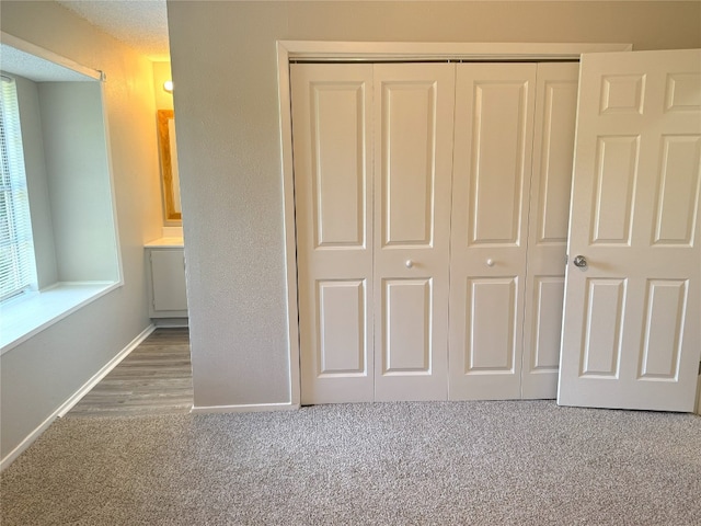 905 Rolling Green Dr, Round Rock, TX 78664 - unfurnished bedroom featuring a closet, carpet flooring, and baseboards