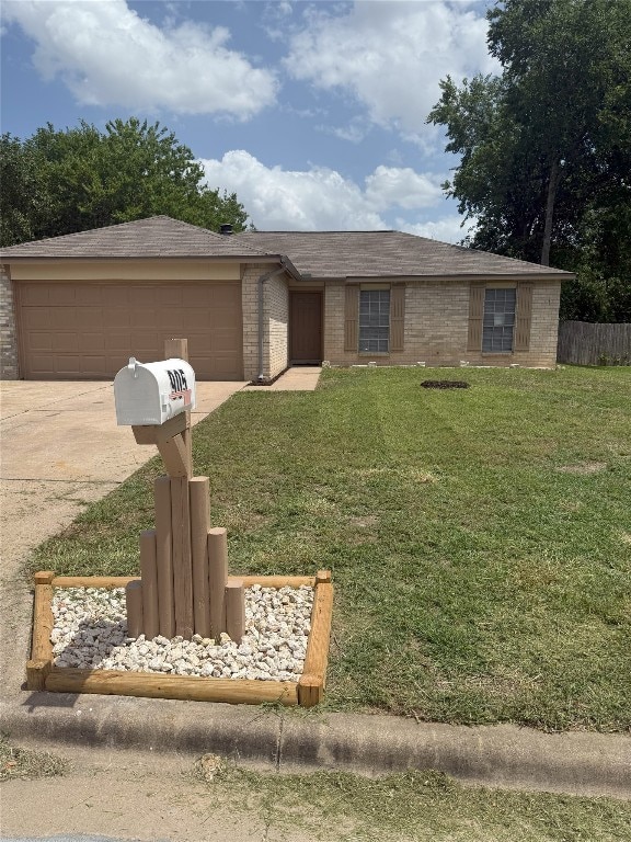 905 Rolling Green Dr, Round Rock, TX 78664 - view of front of house with driveway, a garage, and brick siding