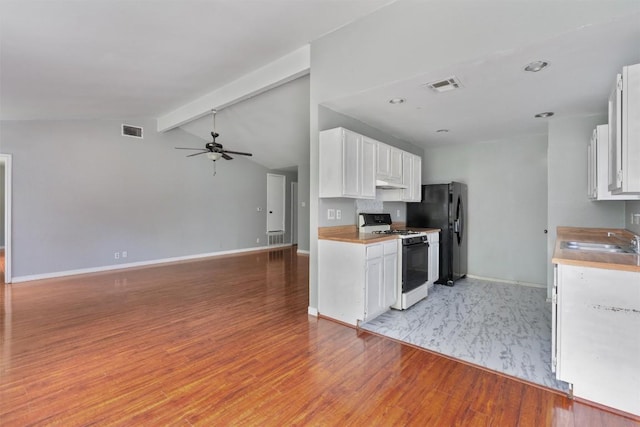 1806 Krizan Ave, Austin, TX 78727 - kitchen featuring white range with gas cooktop, a sink, freestanding refrigerator, light wood-style floors, and ceiling fan