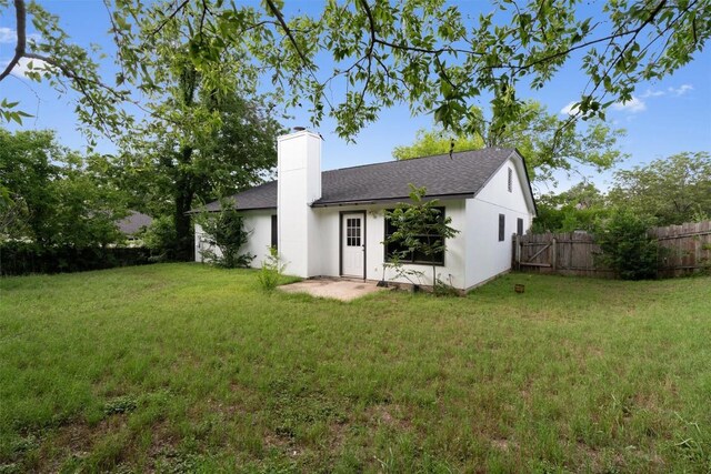 1806 Krizan Ave, Austin, TX 78727 - back of house with a chimney and roof with shingles