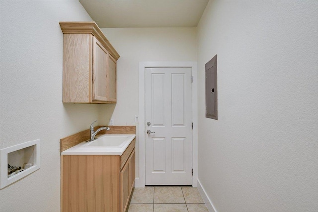515 Mill Pond Path, Georgetown, TX 78633 - laundry room featuring washer hookup, cabinet space, electric panel, light tile patterned floors, and baseboards