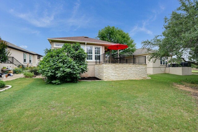 515 Mill Pond Path, Georgetown, TX 78633 - rear view of property featuring a yard and stucco siding