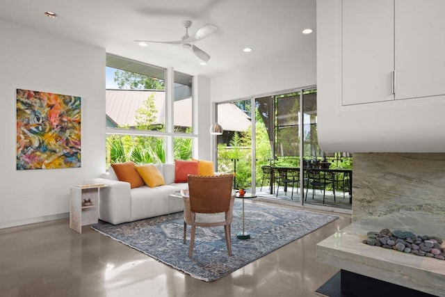 1003 E 8th St, Austin, TX 78702 - living room with plenty of natural light, finished concrete flooring, recessed lighting, and a ceiling fan
