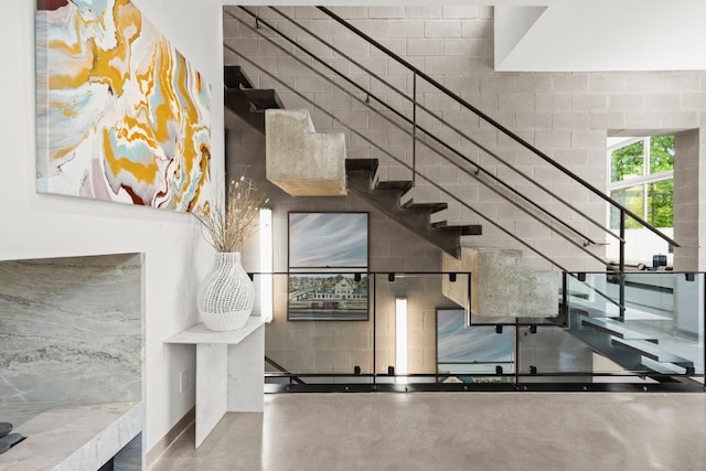 1003 E 8th St, Austin, TX 78702 - stairs featuring concrete flooring and baseboards