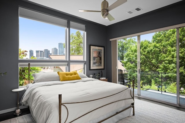 1003 E 8th St, Austin, TX 78702 - bedroom with access to outside, a ceiling fan, and a view of city