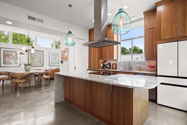 1003 E 8th St, Austin, TX 78702 - kitchen with island range hood, freestanding refrigerator, dishwasher, concrete floors, and decorative backsplash