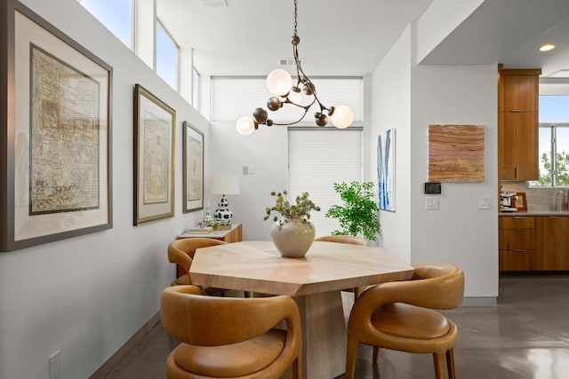 1003 E 8th St, Austin, TX 78702 - dining area with finished concrete flooring and a chandelier