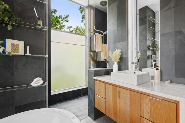 1003 E 8th St, Austin, TX 78702 - bathroom with a soaking tub, vanity, and a shower