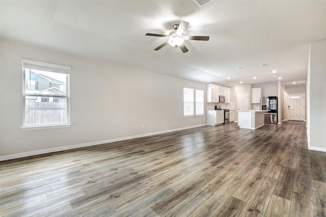 2824 Smokehouse Trl, Round Rock, TX 78665 - unfurnished living room featuring dark wood finished floors, ceiling fan, baseboards, and recessed lighting