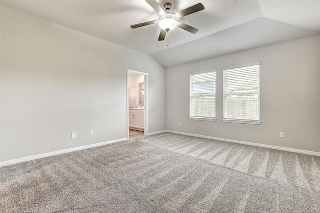 2824 Smokehouse Trl, Round Rock, TX 78665 - empty room with light carpet, vaulted ceiling, baseboards, and a ceiling fan