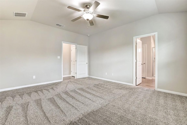 2824 Smokehouse Trl, Round Rock, TX 78665 - unfurnished bedroom with vaulted ceiling, carpet floors, baseboards, ceiling fan, and ensuite bath