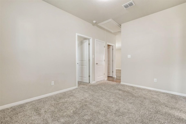 2824 Smokehouse Trl, Round Rock, TX 78665 - spare room featuring attic access, light colored carpet, and baseboards