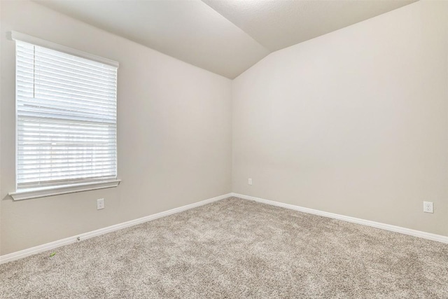 2824 Smokehouse Trl, Round Rock, TX 78665 - carpeted empty room featuring vaulted ceiling and baseboards