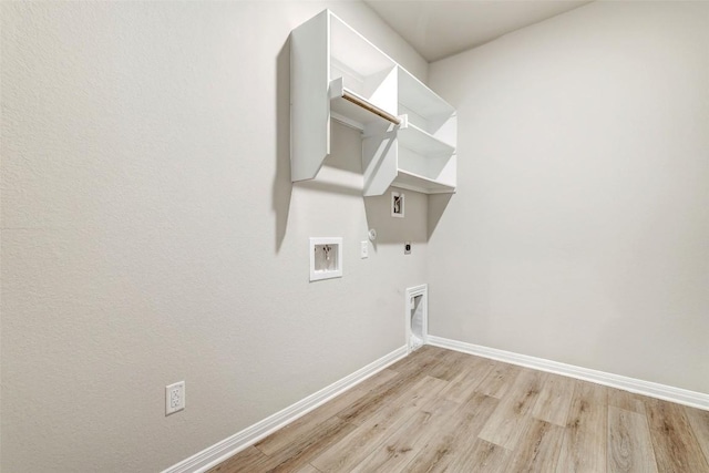 2824 Smokehouse Trl, Round Rock, TX 78665 - laundry room with electric dryer hookup, hookup for a gas dryer, light wood-type flooring, and washer hookup