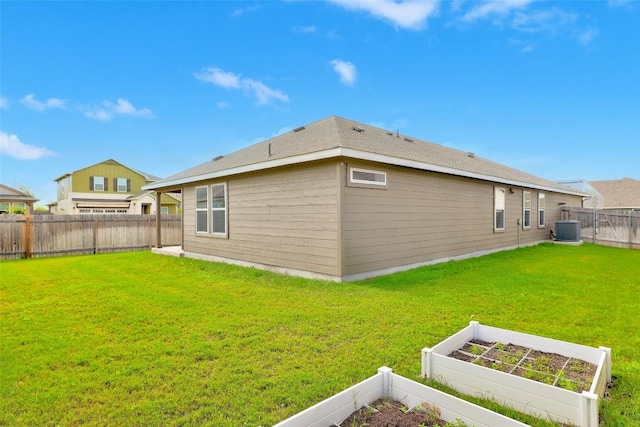 2824 Smokehouse Trl, Round Rock, TX 78665 - rear view of house with a vegetable garden and a fenced backyard