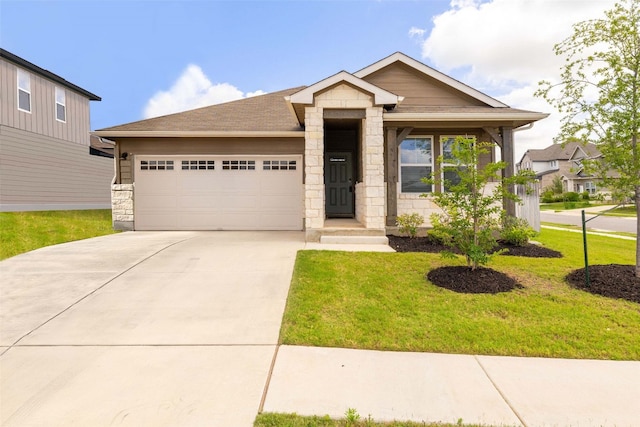 2824 Smokehouse Trl, Round Rock, TX 78665 - view of front facade with a garage, stone siding, driveway, and a front yard
