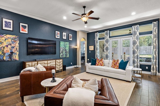 20012 Moorlynch Ave, Pflugerville, TX 78660 - living room featuring arched walkways, ceiling fan, crown molding, recessed lighting, and wood finished floors